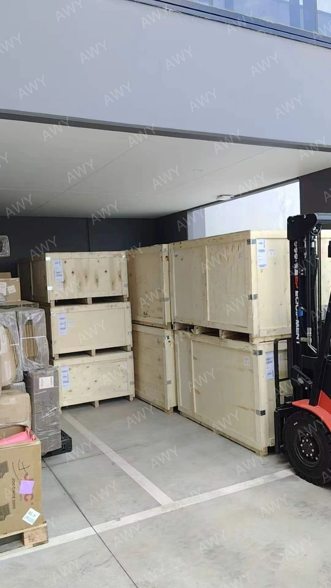 Packed mower delivery crates ready for shipment