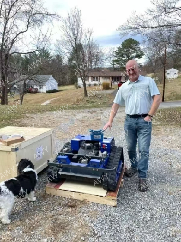 Customer receiving delivered blue tracked mower outdoors